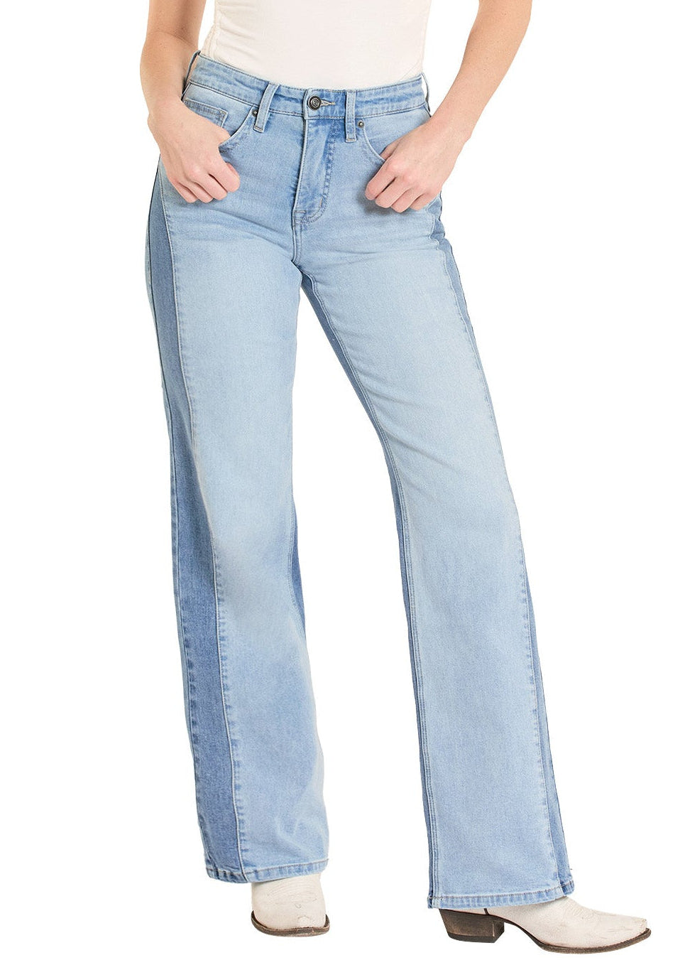 Woman wearing light blue jeans and a cream sleeveless top with a white hat on a white background