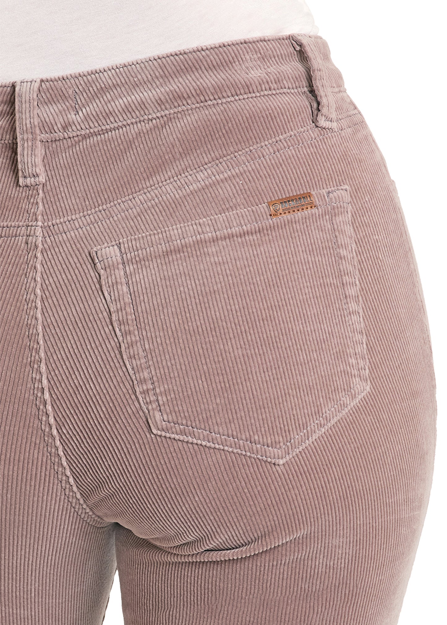 Close-up of a pair of pink corduroy pants with a brand label on a white background