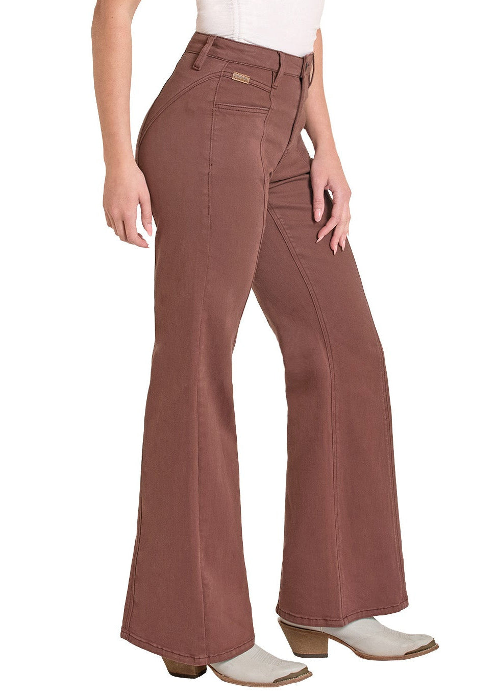 Woman wearing a white sleeveless top and brown bell-bottom pants with a cowboy hat on a white background