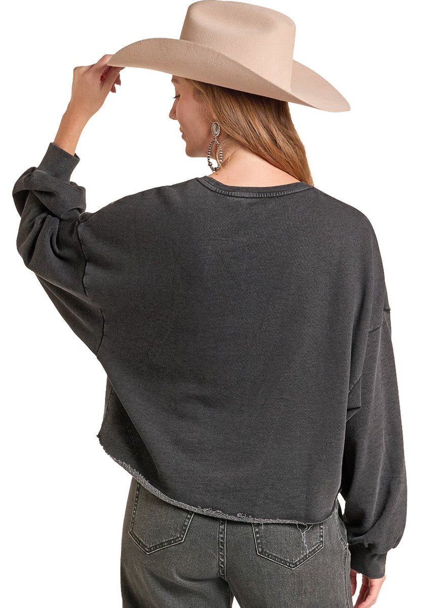 A woman shown from the back wearing a dark charcoal gray cropped sweatshirt, matching washed gray jeans.