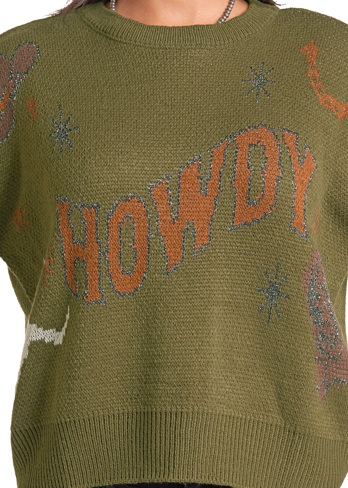 An olive green knit sweater featuring the word 'HOWDY' in large orange letters across the chest, with small decorative motifs in blue, brown, and white.