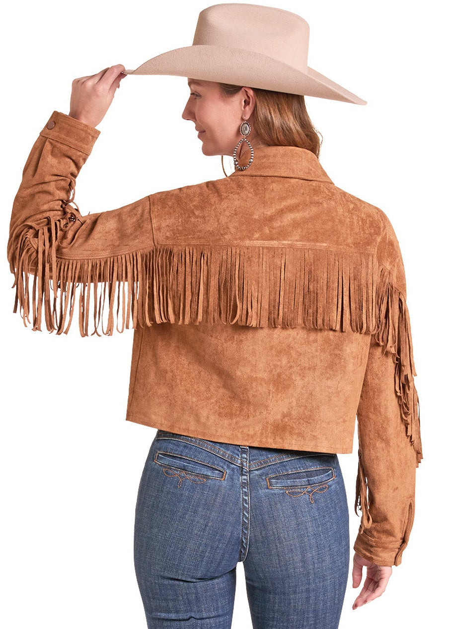 A woman shown from the back wearing a tan suede fringe jacket, blue jeans.