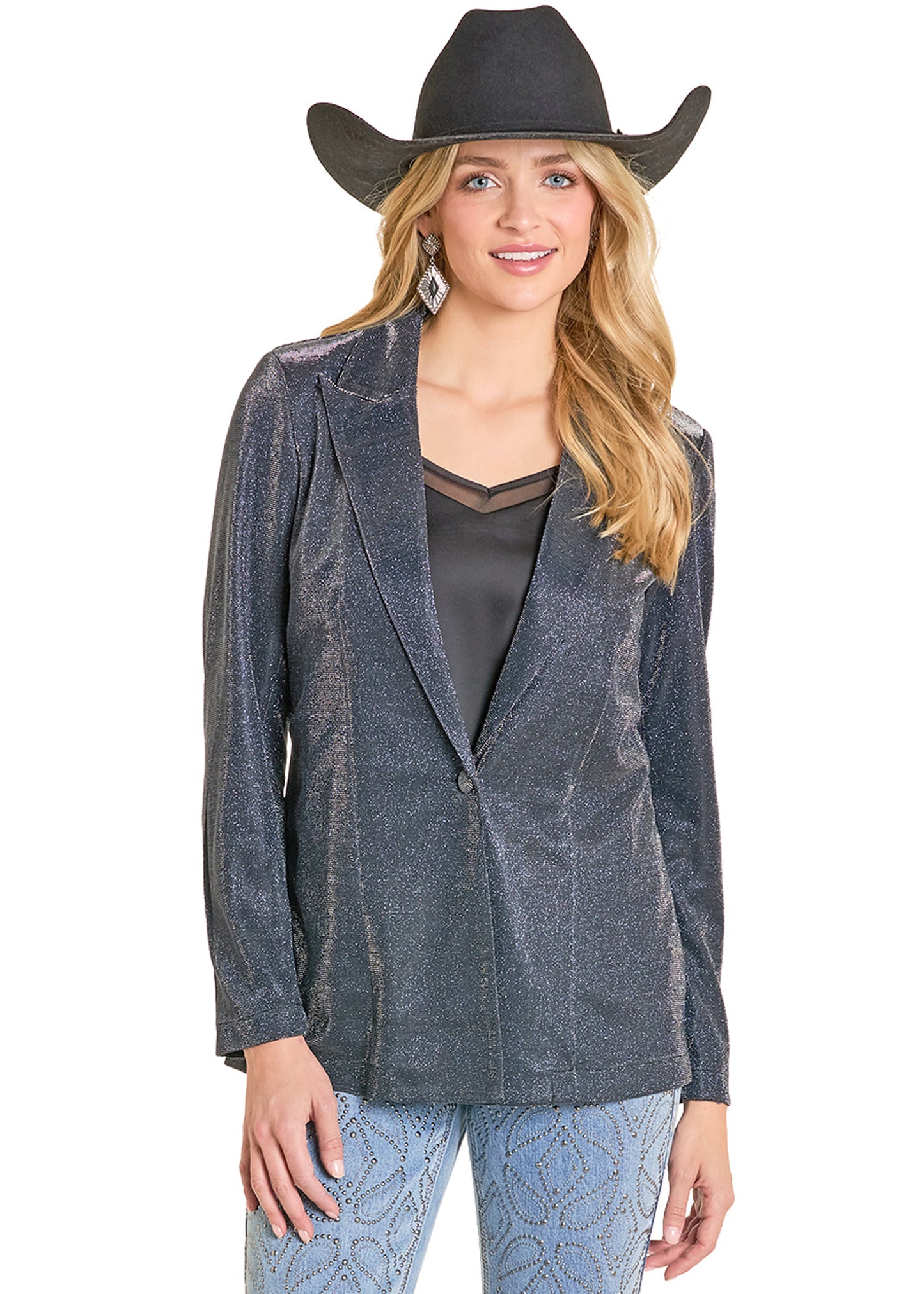 Woman wearing a dark blue blazer, black top, and patterned pants with a black cowboy hat on a white background.