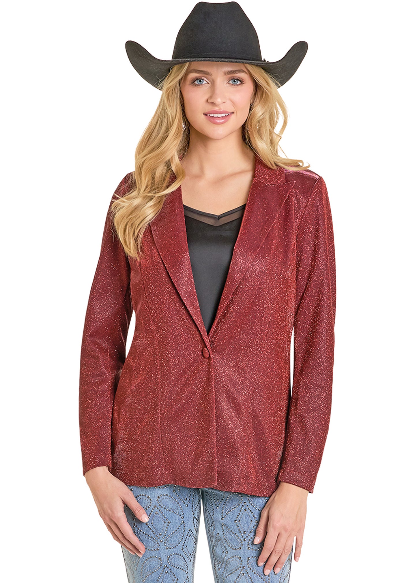 Woman wearing a red patterned jacket, black top, and blue jeans with a cowboy hat on a white background