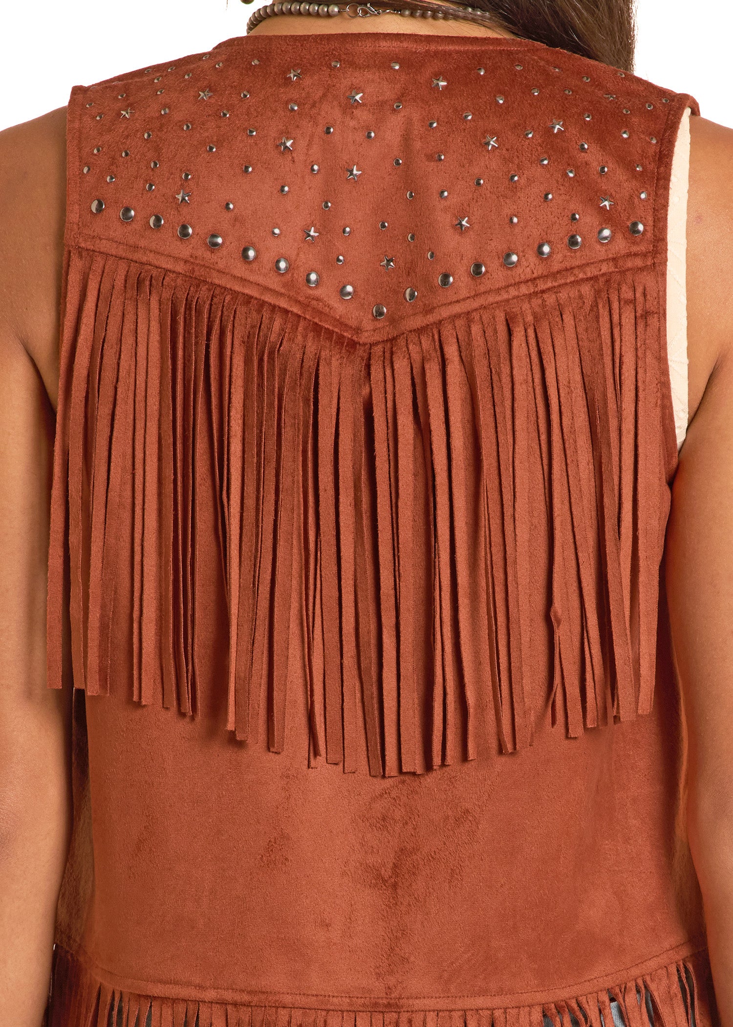 Brown suede vest with fringe and studs on a person