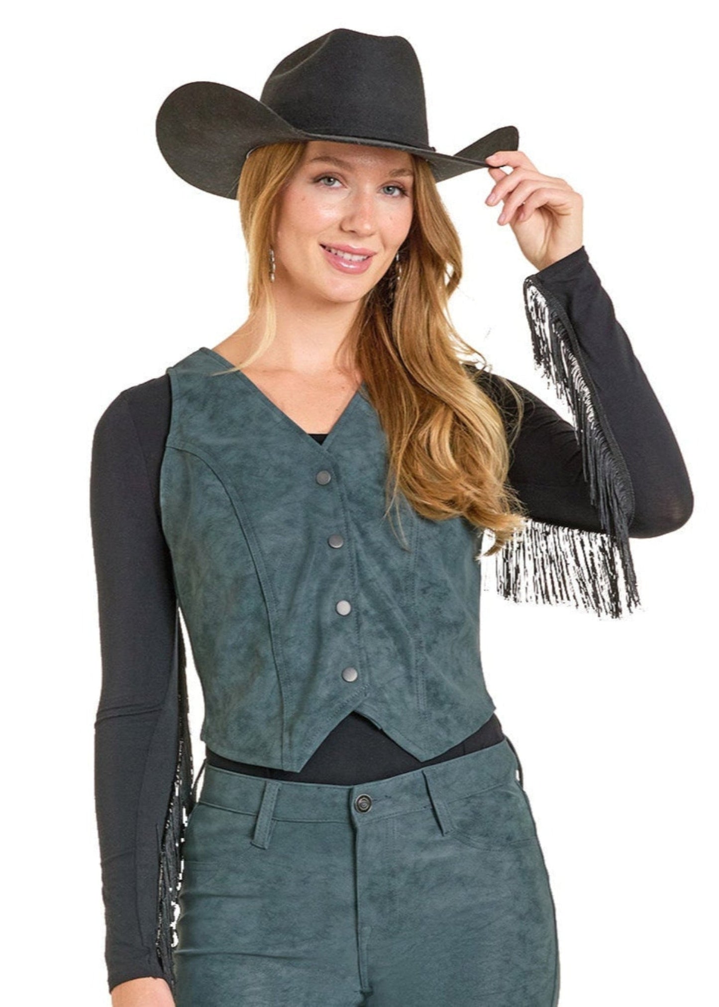 Woman wearing a cowboy outfit with a vest, pants, and hat on a white background