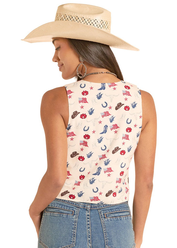 Woman wearing a sleeveless top with car pattern and blue jeans on a white background
