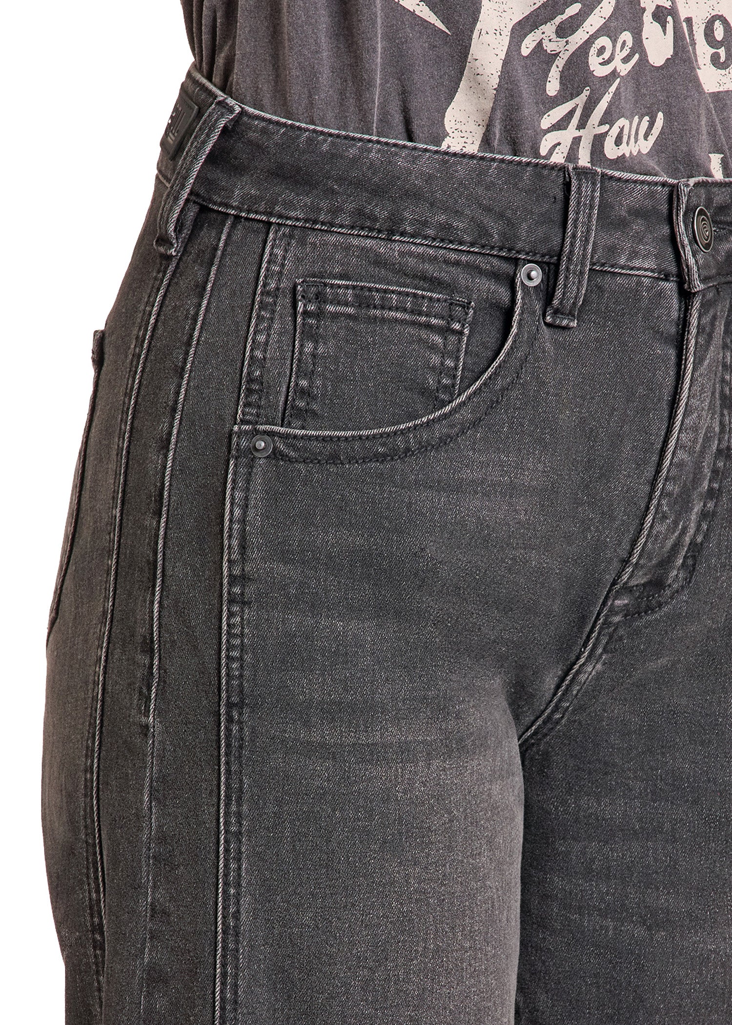 Close-up of a person wearing dark gray washed denim jeans, showing the front pocket, waistband, and part of a graphic t-shirt.