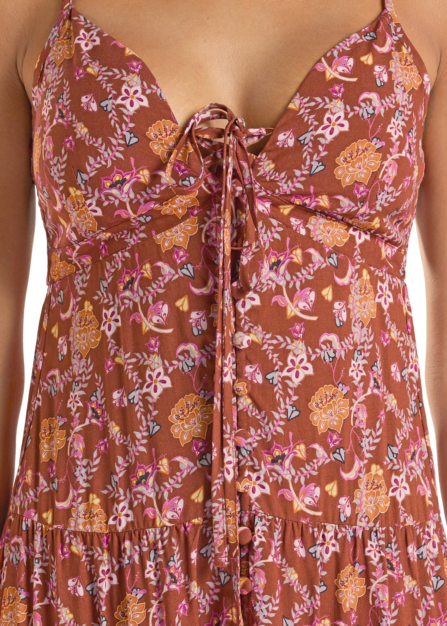 Floral patterned dress with a tie detail on a white background