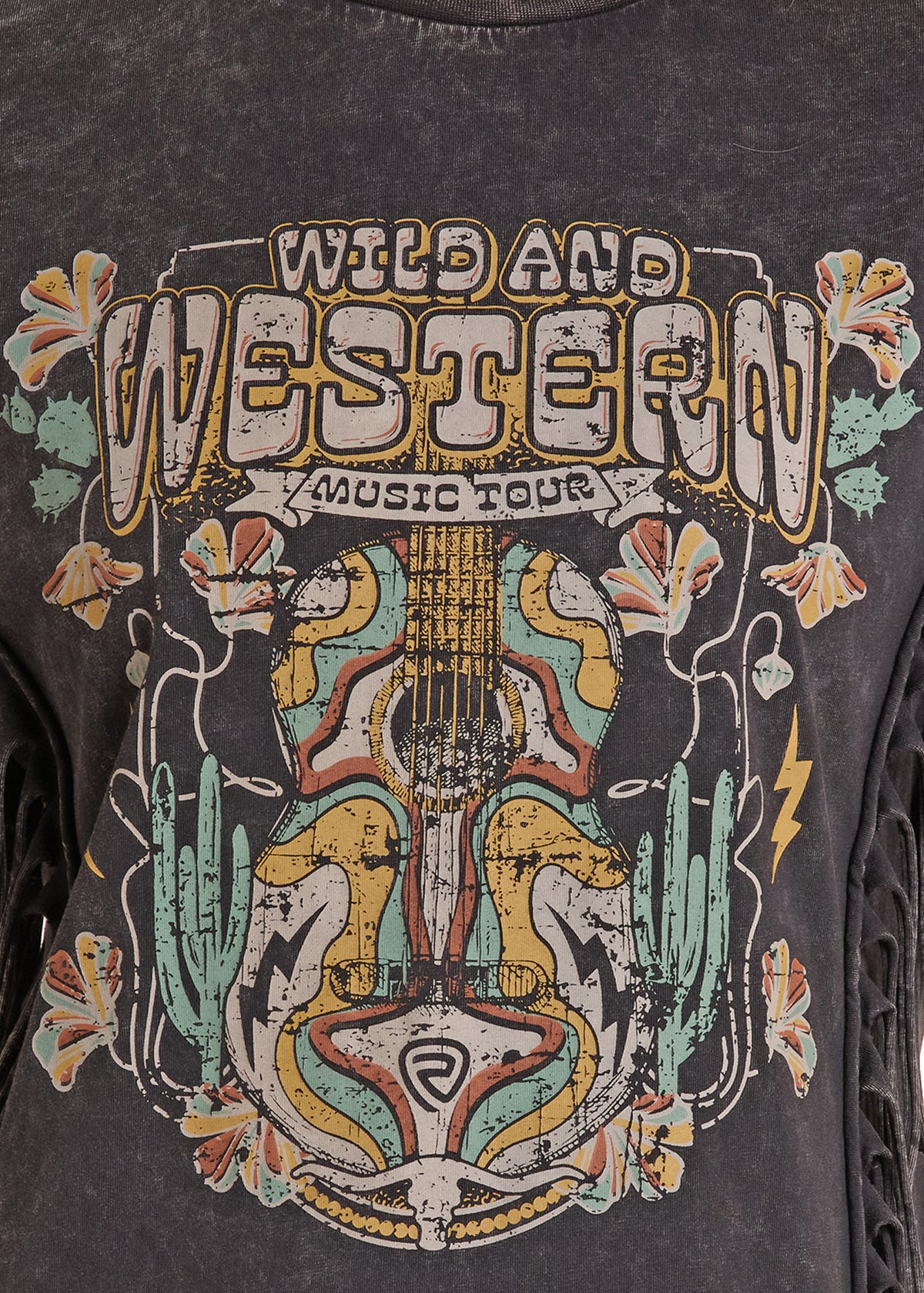 Close-up of a dark gray acid-wash graphic t-shirt featuring a western-themed design with the text 'WILD AND WESTERN MUSIC TOUR' and an illustrated guitar, cactus, and floral motifs.