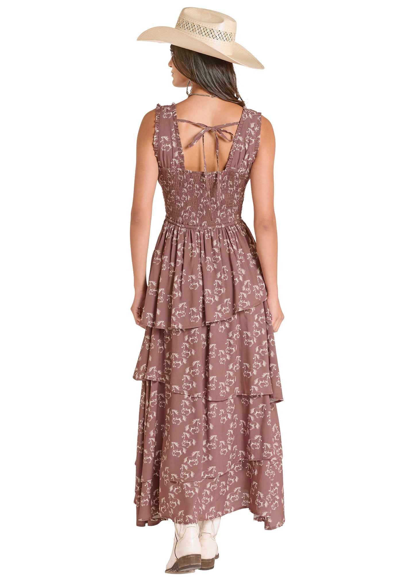 Woman wearing a floral dress with a beige hat on a white background