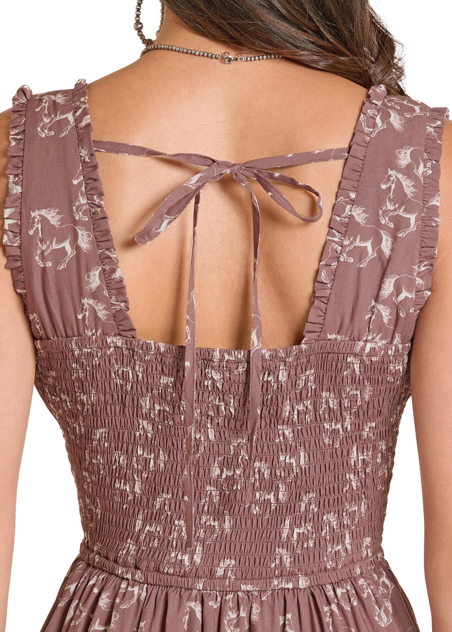 Brown floral dress with open back on a white background