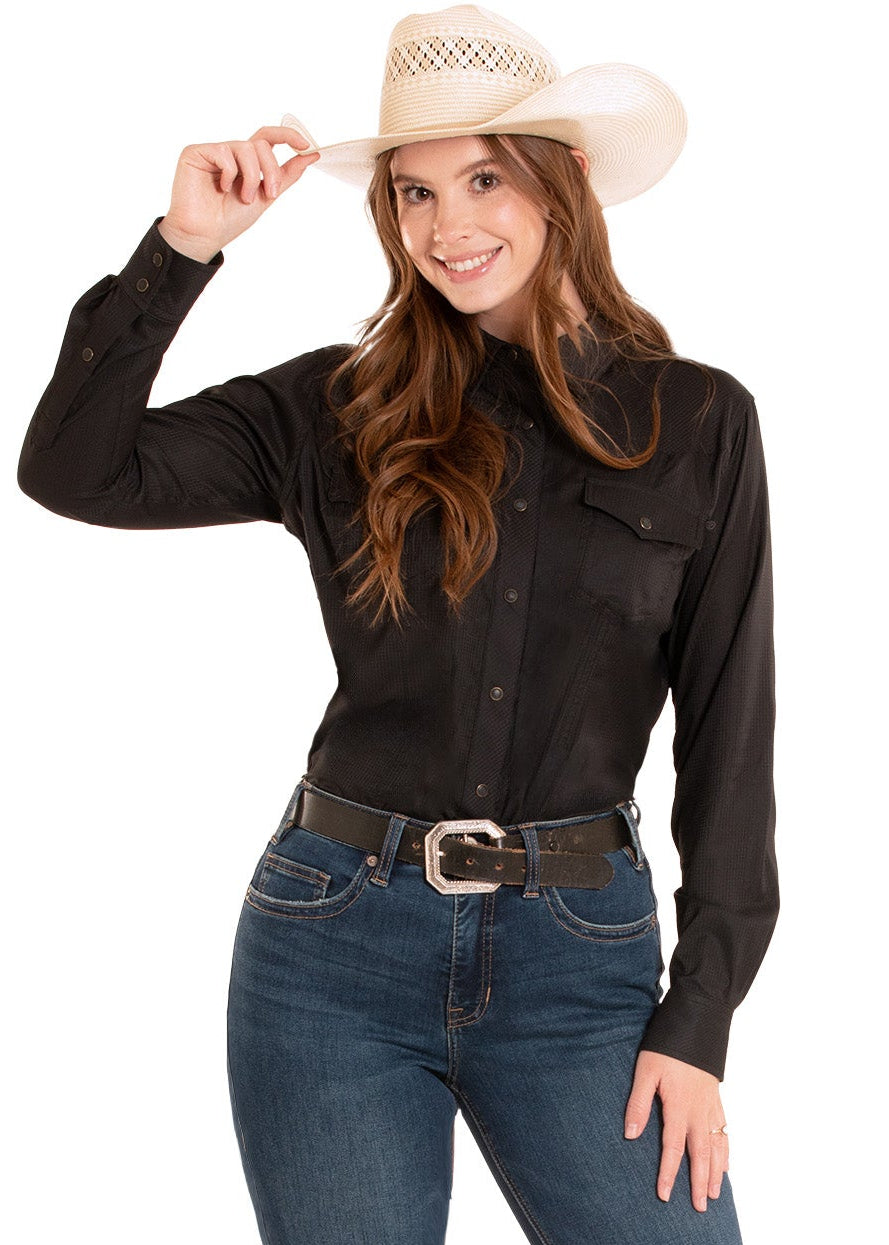 Woman wearing a black shirt, blue jeans, and a cowboy hat on a white background