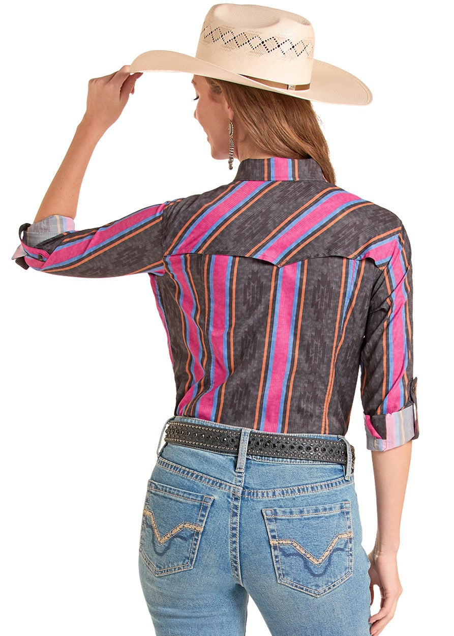Person wearing a striped shirt and jeans with a white background