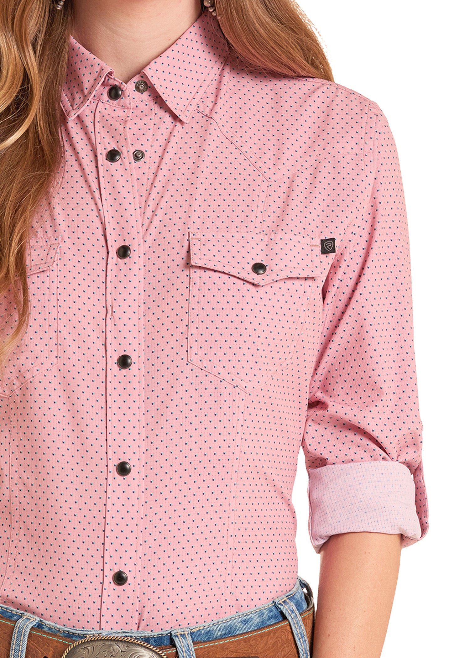Pink patterned shirt worn by a person on a white background