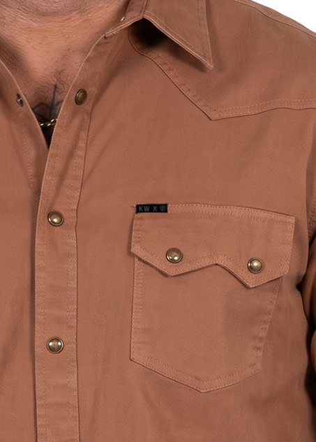 Close up of a a brown long-sleeve western-style button-up shirt pocket