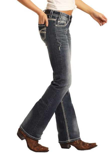 Woman wearing a white t-shirt, blue jeans, and a brown hat on a white background