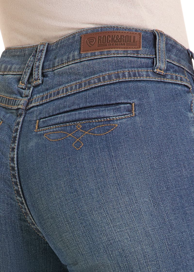 Close up of a welt pocket with boot stitching on a pair of woman's jeans. 